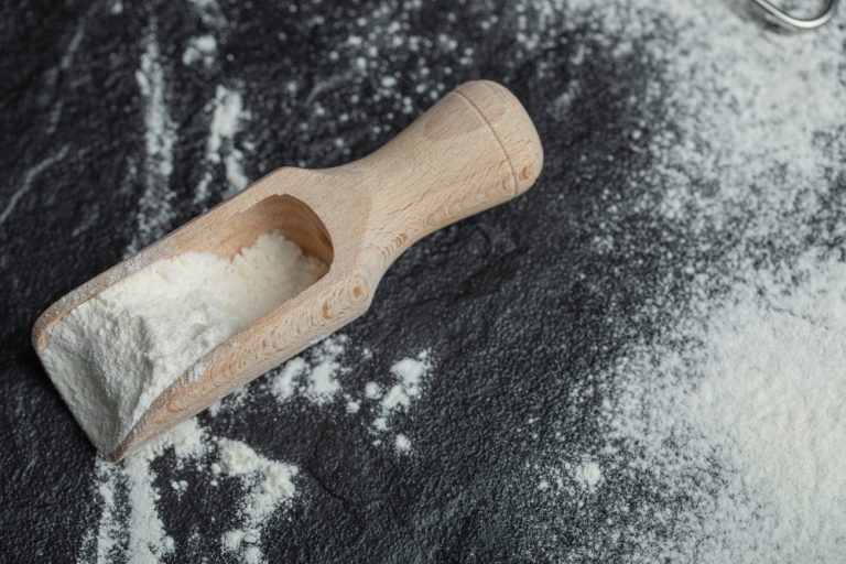 wooden spoon with flour black